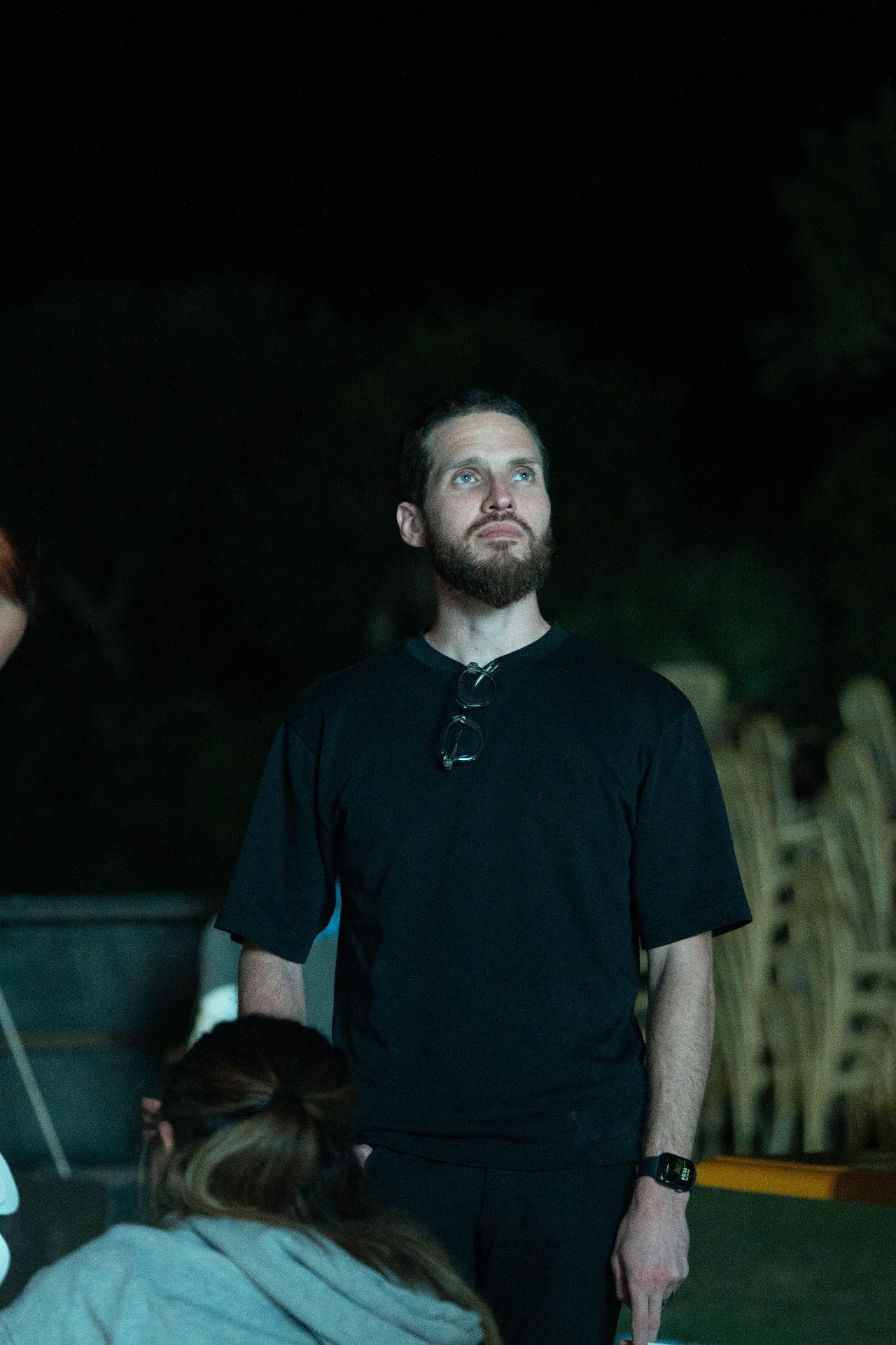 Gastón watching the show come to life at night.