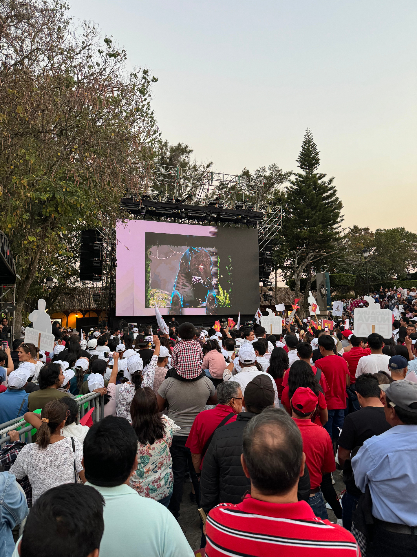 The jaguar reveal on the main screen seen from the audience in the late afternoon.