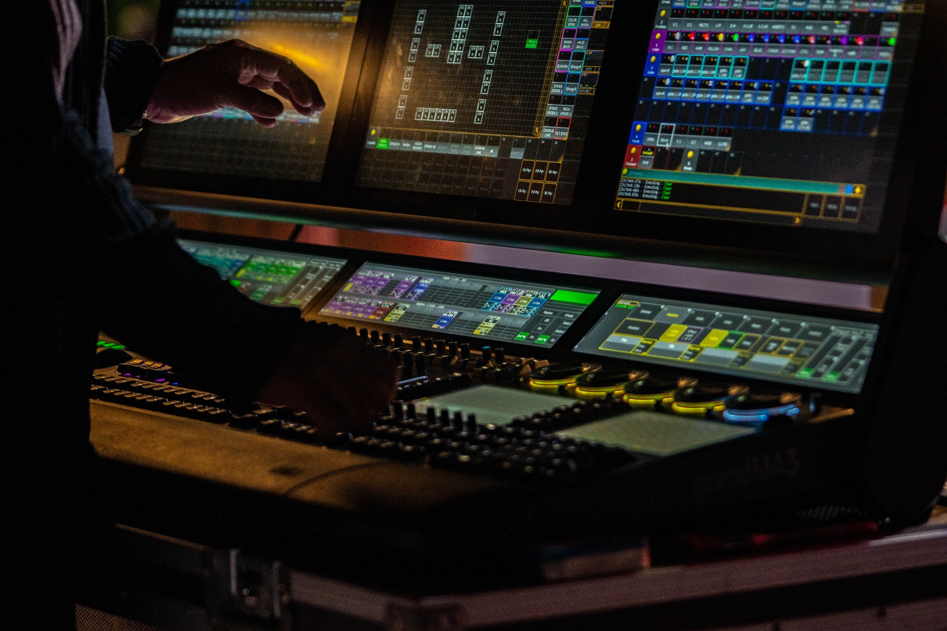 Lighting console programming the show in the dark.
