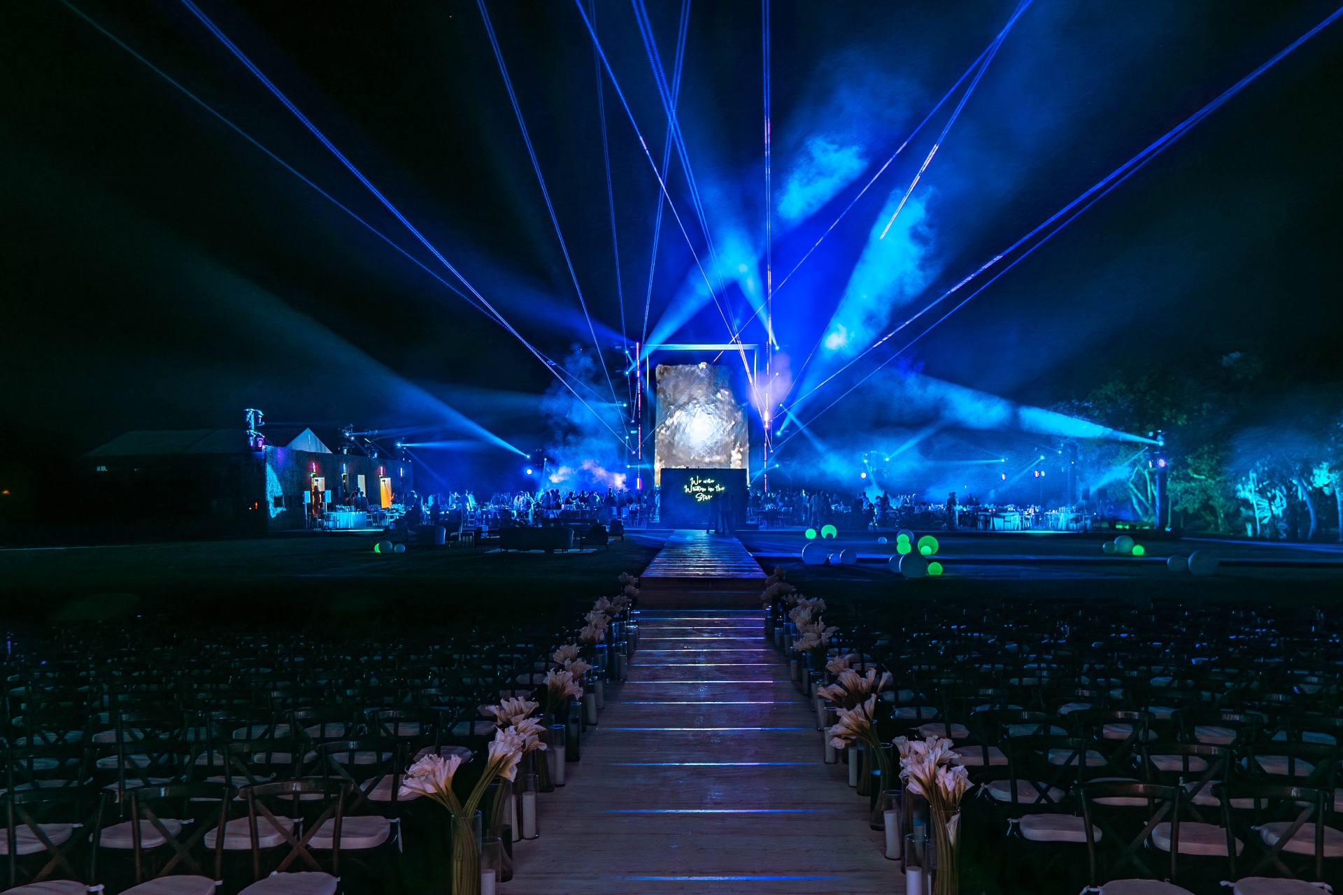 The finished gala — lasers, lights and the aisle under the stars.